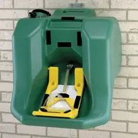 Gravity-fed portable eyewash station with 16-gallon capacity for emergency eye irrigation. Meets ANSI Z358.1 standards. Activation via gravity feed; uses bottle refill type. Water preservative and media sold separately. Contents not included. Suitable for facilities without plumbed water
