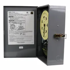 The INTERMATIC T7401B is a 7-day electromechanical timer switch with a metal body for indoor surface mounting. It operates at 120V AC with a single-pole single-throw (SPST) switching configuration. This timer is used for basic scheduling of electrical loads such as lighting, HVAC, or other equipment on a repeating weekly program.
