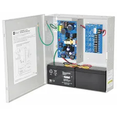 This power supply board with steel enclosure converts 115V AC input to selectable 12VDC at 3.5A or 24VDC at 3A output. It is used in access control, security, and industrial systems requiring regulated DC power distribution.