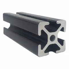 This 10 Series T-slot profile is a square grooved inch profile made from anodized aluminum with a black finish. It measures 1 in x 1 in, is 12 ft long, and features 4 slots. With a yield strength of 25,000 psi, it is used for building modular industrial structures such as machine guards, workstations, conveyors, and automation frames.