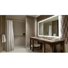 Rectangular lighted vanity mirror with frosted glass construction and side lighting. Measures 60 in wide by 36 in high with a 1 3/4 in depth. Suitable for grooming and ambient lighting in bathrooms.