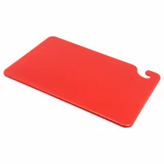 This cutting board is made of co-polymer material in red color, measuring 18 inches in length and 12 inches in width. It is NSF certified for use in commercial food preparation environments. The red color is commonly used to designate boards for raw meat to help prevent cross-contamination.