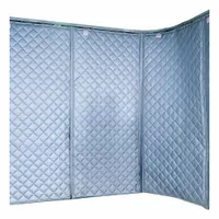 Track-mounted hanging acoustic curtain with a 1 in thickness, 12 ft overall length, and 4 ft overall width. Features a curved panel shape and includes a curved track. Used for noise reduction in industrial environments such as manufacturing plants and machine shops