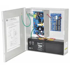 Steel-enclosed power supply board with 8-fuse distribution. Input 115V AC. Output selectable: 12VDC at 3.5A or 24VDC at 3A. Used to power access control, security, and fire alarm systems in commercial and industrial installations.