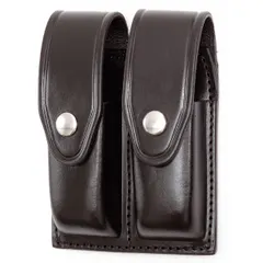 Black leather magazine pouch with basket weave pattern and snap closure. Designed for carrying spare magazines on duty belts, suitable for law enforcement and security personnel.