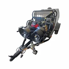 Hot water, heavy-duty pressure washer mounted on a trailer for portability. Delivers a maximum operating pressure of 3,500 psi. Suitable for cleaning grease, oil, and grime from equipment, vehicles, and industrial surfaces.