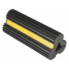 Black rubber wheel chock without handles, supplied as a single unit. Measures 4 1/2 in length, 10 in width, and 3 3/4 in height. Used to prevent parked vehicles, trailers, or industrial equipment from rolling, providing a non-slip barrier under tires in loading docks, warehouses, and maintenance bays.