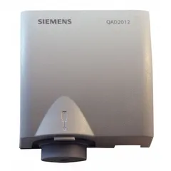 Strap-mount temperature sensor with standard plastic housing for surface and cable temperature measurement. Features a temperature range of -22°F to 266°F and accuracy of ±0.54°F. Hardwired connection with Modbus protocol for integration into building automation systems. Includes strap-on cable for mounting on pipes, ducts, or cables.