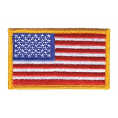 This embroidered emblem features a gold U.S. Flag design on a plastic base. It measures 3 3/8 inches by 2 inches and is attached by sewing onto fabric. Commonly used on uniforms, bags, or apparel for identification or decoration.