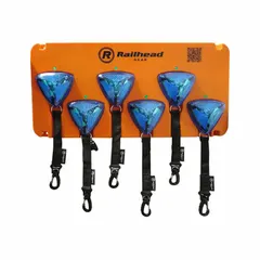Battery-powered flashing light with blue lens and magnetic mounting. Rated IPX6 for wet or outdoor conditions. Overall length 3 3/16 in. Suitable for visual signaling in industrial facilities, construction zones, and rail environments.