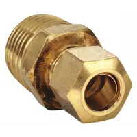 This low-lead brass compression fitting connects 3/8 in OD tubing to 1/2 in threaded pipe. It is used in industrial fluid systems for applications requiring a leak-tight seal without soldering or flaring, such as instrumentation, pneumatic, and hydraulic lines