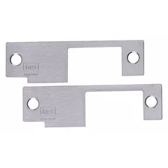 Electric strike faceplate compatible with HES Series 8500 electric strikes. Measures 1 1/4 in wide by 4 7/8 in high. Used as a replacement or upgrade component in access control systems for commercial and industrial door hardware.