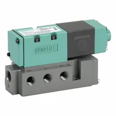 Four-way, two-position solenoid valve with spring return and non-locking manual override. Operates on 110-120V AC with plug-in electrical connection. Directs compressed air to actuate pneumatic cylinders, actuators, or other industrial equipment in manufacturing, packaging, and material handling systems.