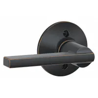 This SCHLAGE passage lever lockset features a Latitude style lever in an Aged Bronze/Brass finish. It is ADA compliant for accessibility and designed for interior doors where locking is not required. The lockset is not ligature-resistant and has no visual indicator