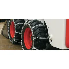 This PEERLESS tire chain is a carbon steel twist-link ladder chain designed for skid loaders and skid steers. It fits 33 x 10.5 x 15 tires and provides traction on snow, ice, or mud to reduce slippage in worksite conditions.