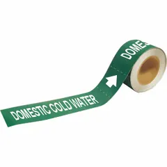 Green adhesive pipe marker with white legend reading 'Domestic Cold Water' and flow direction arrows. Fits pipe outer diameters of 2-1/2 to 6 inches. Each roll contains 25 markers. Used to identify cold water piping in facilities.