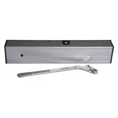 This LCN 4314 Series high energy door operator is a non-hold-open unit designed for interior heavy-traffic applications requiring automatic door closing. It features an aluminum painted finish and measures 19 inches in length, 2 9/16 inches in width, and 3 1/2 inches in height. Suitable for commercial or institutional settings where reliable door control is needed without ADA compliance.