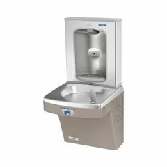 On-wall single drinking fountain with integrated bottle filler. Stainless steel housing in Tan Sandstone finish. Chilling capacity of 8 gallons per hour at 50°F. Touchless sensor for hygienic operation. Top panel access for filter maintenance. Suitable for commercial and institutional settings such as schools, offices, and public buildings.