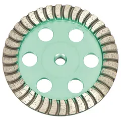This 6-inch diameter turbo diamond segment cup grinding wheel features a 5/8"-11 arbor and 36 segments in a green cup design. It is used for aggressive material removal and surface preparation on concrete, stone, and masonry.