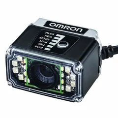 Fixed-location miniature multicode reader with red light illumination. Operates at 5V DC and communicates via USB 2.0 High Speed, supporting Ethernet over USB, HID, and RS-232C. Image resolution of 1280 x 960 px. IP54 rated for dust and splash resistance. Suitable for automated scanning of 1D and 2D barcodes in industrial environments such as assembly lines and packaging.