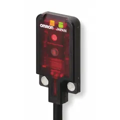 The OMRON E3T-FD11 is a rectangular photoelectric sensor from the E3T series with a PBT body. It features a prewired cable with bare-wire electrical connection and operates on a 12-24V DC supply with NPN output. This sensor is used for object detection in industrial automation, packaging, and material handling applications.