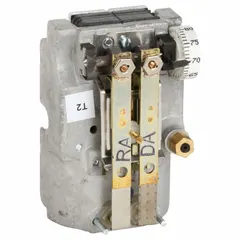 This pneumatic thermostat is designed for heating and cooling applications in commercial HVAC systems. It features a temperature control range of 55° to 85°F, with direct action at 15 psig and reverse action at 20 psig. The unit has 2 high-volume pipes for air flow output and is intended for vertical mounting (cover not included).