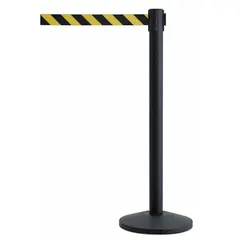 This retractable belt post barrier features a black metal alloy post and a steel base. The 7 1/2 ft belt is black/yellow with a chevron pattern and no legend. Used for pedestrian flow management and cordoning off areas in industrial, warehouse, and public settings.