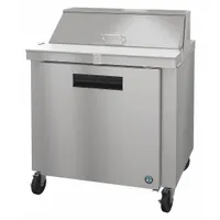 This HOSHIZAKI refrigerated prep table provides 8.7 cu ft of cold storage for ingredients and a worktop surface for food preparation. It features a thermostatic control and one door. Suitable for commercial kitchens, restaurants, and catering operations
