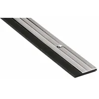 This door sweep seals the gap under a door to block drafts, dust, insects, and noise. It is made of stainless steel with a black finish, measuring 36 inches in length and 3/16 inch in width. Suitable for standard door bottom sealing applications in commercial and industrial facilities