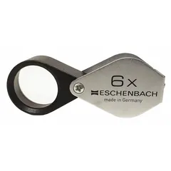 Folding magnifier with a metal frame, 6X magnification, 23 mm lens diameter, and 2 in focal distance. Suitable for close inspection of fine details in industrial quality control, electronics assembly, and precision machining.