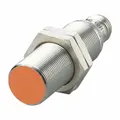Shielded cylindrical inductive sensor with built-in 4-pin M12 connector. NPN output, 3 wires, DC supply voltage 10-30V. Used for non-contact detection of metal objects in automation, packaging, and material handling for position sensing and machine control.