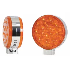 Amber round LED turn signal light with 4 5/16 in overall diameter and 2 in overall depth. Permanent installation with wire leads. Complies with SAE J2261. Used on trailers, trucks, and heavy equipment for turn indication.