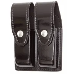 This duty equipment pouch is constructed from black synthetic polymer with a high-gloss finish and features a snap closure for secure retention. Designed to carry magazines, it is suitable for use by law enforcement, security, and military personnel requiring quick access to spare ammunition while on duty.
