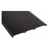 This 3 ft aluminum saddle threshold features a fluted transition type. It is used to seal the gap under doors, preventing drafts, moisture, and debris entry while providing a smooth transition between flooring surfaces in commercial or industrial buildings