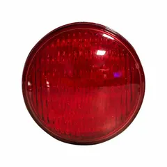 This LED marker light features a round shape, red lens, and recessed mount with screw fastening. It is used as a side or rear clearance light on trailers, heavy equipment, and industrial vehicles to improve visibility in low-light conditions.