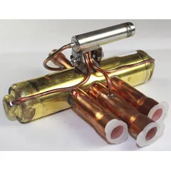 Straight-tube reversing valve for heat pump systems, with a 1/2 in suction line. Suitable for R410A and HFC refrigerants, covering a capacity range of 0.5 ton to 1.7 ton. Used to direct refrigerant flow for switching between heating and cooling modes.