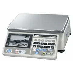 The A&D WEIGHING HC-3KI is a compact bench scale from the HC-I Series with a stainless steel platform measuring 8 1/4 in x 11 3/4 in. It offers a readability of 0.001 lb/0.0005 kg and features an integrated RS-232C interface for data communication. This scale is not IP rated and is suitable for general weighing applications in industrial and laboratory settings.