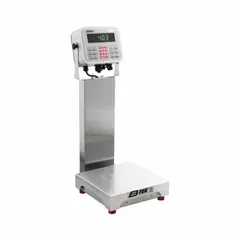 This B-TEK food scale features a 10-inch weighing surface width, 26-inch overall height, and LCD display. It offers readability of 0.002 kg/2 g/0.005 lb/0.08 oz and includes an RS-232 connection port. The IP69K rating enables use in sanitary environments requiring high-pressure, high-temperature washdowns.