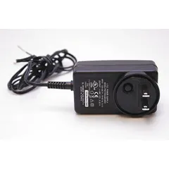 This black plastic power supply is designed for use with power supply systems in industrial communication and phone accessory applications. It provides power delivery for compatible equipment in plant operations.