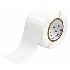Thermal transfer precut label roll measuring 1/2 in x 1 in. Features a rubber aggressive adhesive for permanent bonding. Compatible with THT printer series. Used for industrial identification, asset tagging, cable marking, and component labeling.