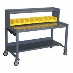 Steel mobile workbench with a louvered panel for hanging tools and a lower shelf for parts or equipment. Fixed-height design with a gray finish. Dimensions: 73 in x 31 in. Suitable for industrial maintenance, assembly, and repair tasks where organized storage and mobility are required.