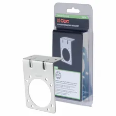 7-way blade connector for trailer wiring systems. Silver finish. Used to connect a towing vehicle's electrical system to a trailer for powering lights, brakes, and turn signals. Suitable for heavy-duty towing applications including trailers, RVs, and equipment haulers.