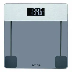 Digital bathroom scale with a tinted glass platform and integrated indicator. Weighs in kilograms with 0.1 kg/0.2 lb readability. Suitable for personal weight monitoring in home or light commercial settings.