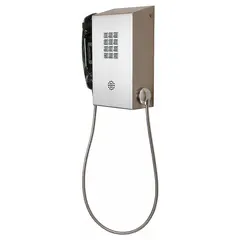 Rugged PSTN telephone for hazardous areas. Silver stainless steel armored housing with keypad and earpiece. Designed for indoor surface-mount installation in demanding industrial environments.
