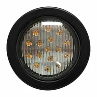 Amber LED warning light for vehicle perimeter applications. Round shape, 2 3/16 in overall width. Operates on 12-24V DC with 8 selectable flash patterns. Includes grommet for grommet mounting; electrical connection via blunt cut wires. Suitable for use on forklifts, utility trucks, and construction equipment to alert nearby personnel