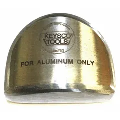 Steel auto body dolly of the heel type, measuring 3-1/8 in long, 2-1/2 in wide, 1-3/8 in high, and weighing 2 lb. Used in auto body repair to back up hammer blows on curved panels for shaping and smoothing sheet metal.