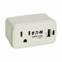 Single-outlet surge protector with a NEMA 5-15P plug, rated 15 A. Gray housing. Not UL rated for healthcare. Suitable for protecting electronics in control panels, workstations, and test equipment where space is limited