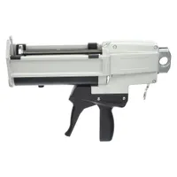 Manual dual-cartridge applicator for 400 mL cartridges. Metal housing supports mixing ratios of 1:1, 2:1, and 4:1. Used for dispensing two-part urethane compounds in bonding, casting, and lining applications
