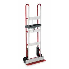 Vertical dual-loop hand truck for moving appliances and equipment. Red frame with 6 in diameter rubber tread-on-core wheels. Ratchet strap tightening type secures loads during transport.