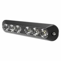 Green rectangular perimeter warning light with black bezel. Operates on 12-24V DC and offers 30 selectable flash patterns. Features bolt mount and blunt cut wires for electrical connection. Overall height 1 3/8 in, width 5/8 in. Used on vehicles to alert nearby personnel of movement or hazard